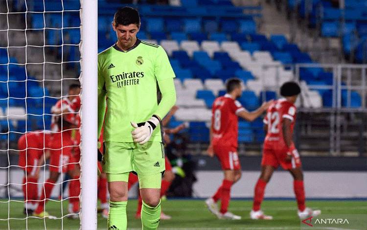 Koper Real Madrid asal Belgia Thibaut Courtois. (Photo by PIERRE-PHILIPPE MARCOU / AFP) (AFP/PIERRE-PHILIPPE MARCOU)