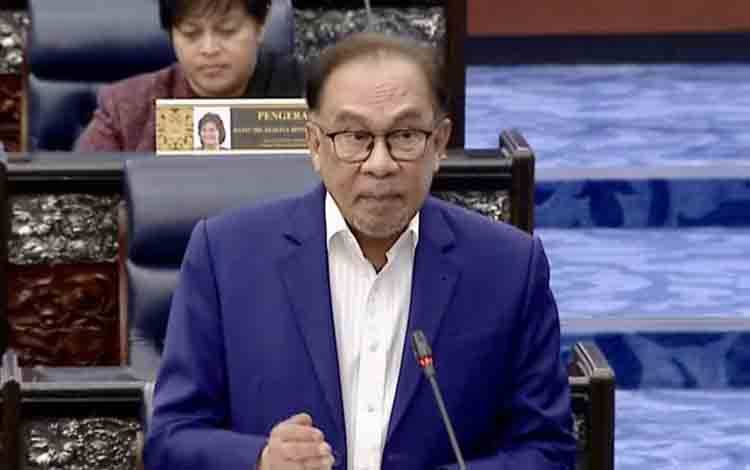Arsip - tangkapan layar - Perdana Menteri Malaysia Anwar Ibrahim menjawab pertanyaan dewan dalam sesi tanya-jawab menteri di Dewan Rakyat, Kuala Lumpur, Selasa (9/7/2024). (ANTARA/Virna P Setyorini)