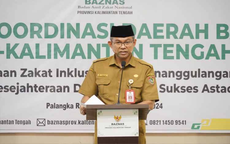 Plh Sahli Gubernur Bidang Pemerintahan, Hukum dan Politik Akhmad Husain saat menyampaikan sambutannya. (FOTO:ABDAN)