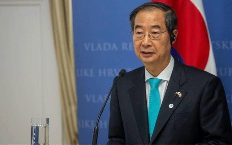 Presiden sementara Korea Selatan sekaligus Perdana Menteri Han Duck-soo akan menghadapi pemungutan suara pemakzulan setelah menolak mengangkat tiga hakim baru untuk Mahkamah Konstitusi. Mahkamah Konstitusi dijadwalkan akan menggelar sidang pertama terkait pemakzulan Presiden Korea Selatan Yoon Suk Yeol yang saat ini sedang non aktif. /ANTARA/Anadolu/py