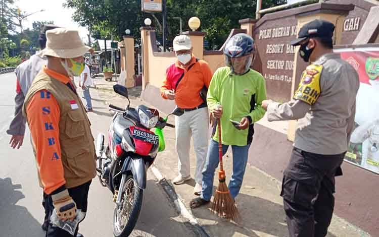 Polsek Dusun Timur dan BPBD Bartim Bersinergi Dalam Operasi Yustisi Covid-19
