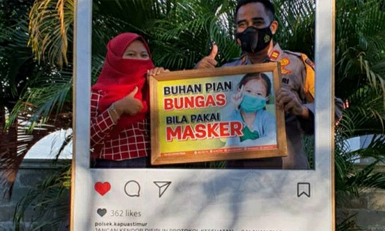 Polsek Kapuas Timur Edukasi Warga Patuhi Prokes Lewat Sarana Photo Booth
