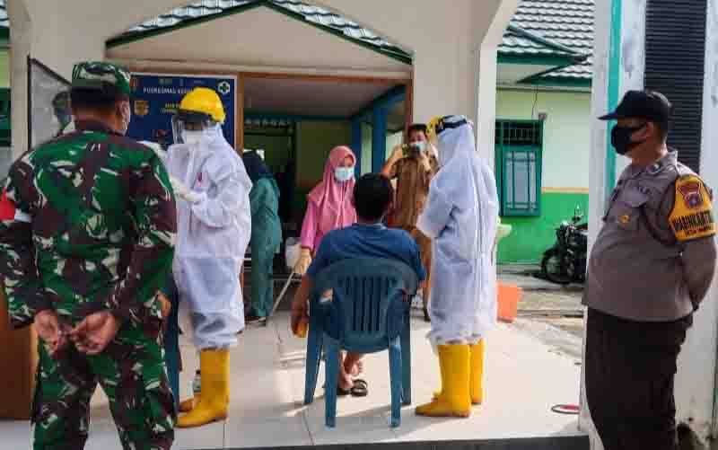 Test Swab di Puskesmas Kereng Pangi Dapat Pengamanan Polisi dan TNI