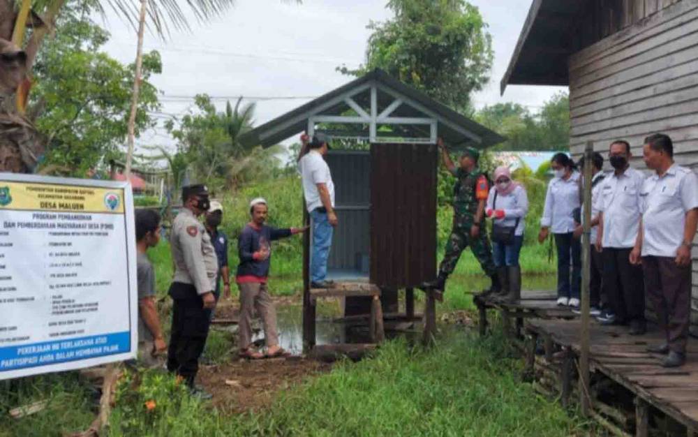 Personel Polsek Basarang Dampingi Monev Tahap II Penggunaan DD